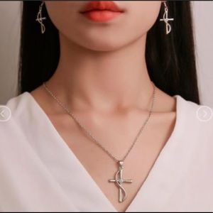 Cross silver set. Necklace and earrings.
